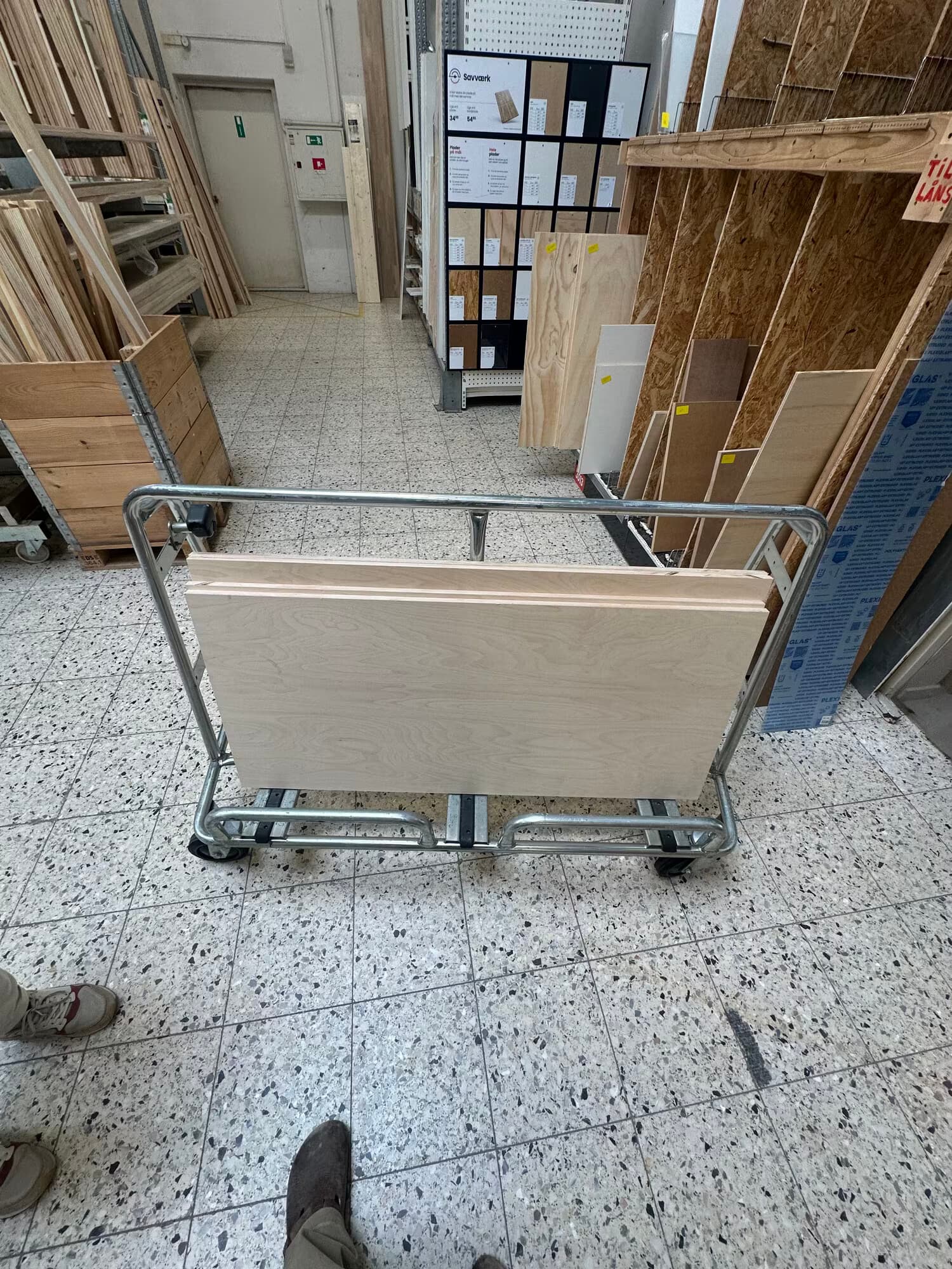 Birch plywood sheets on a cart at the hardware store