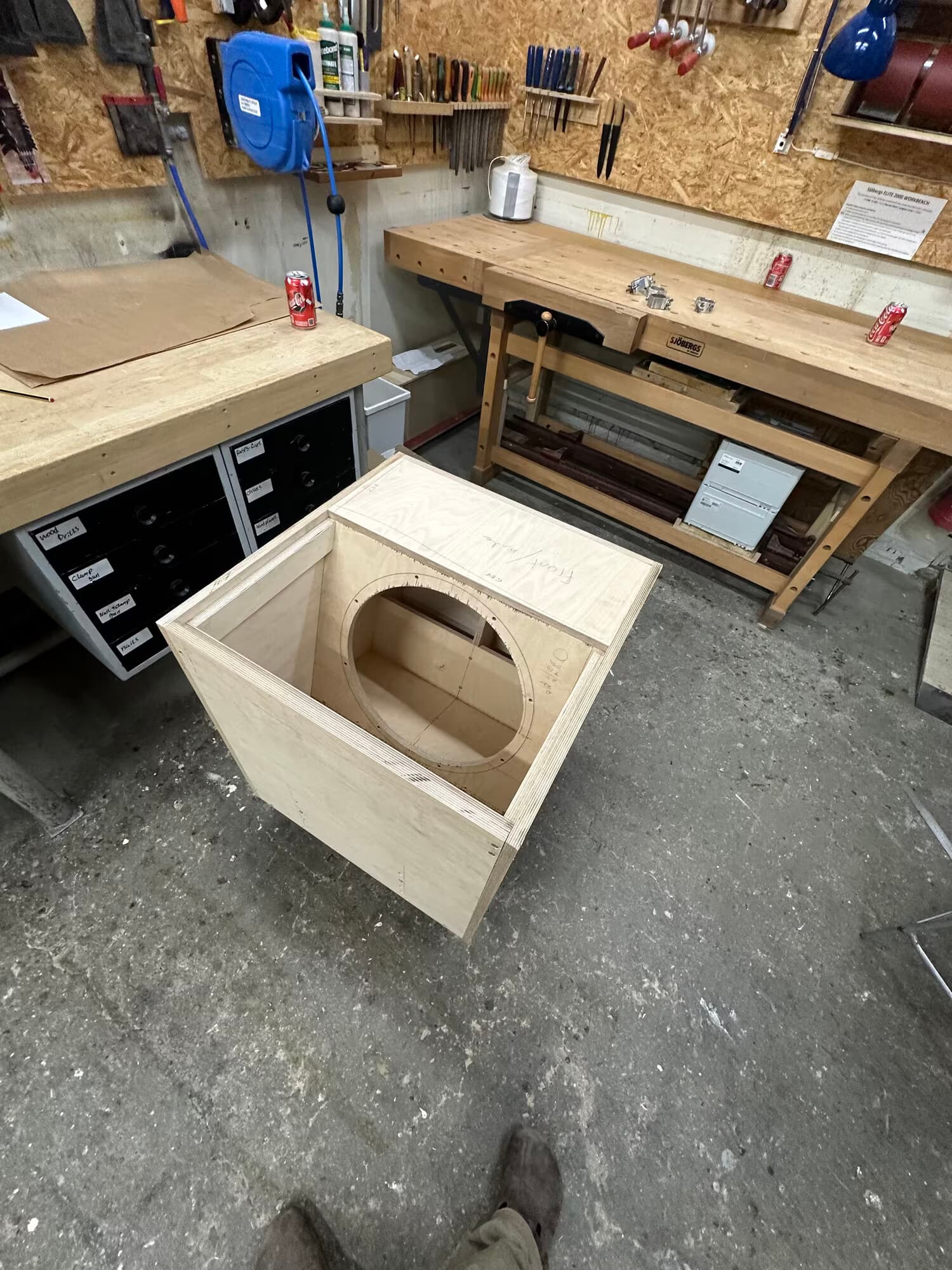 Assembled bare plywood box with the driver cutout, before finishing